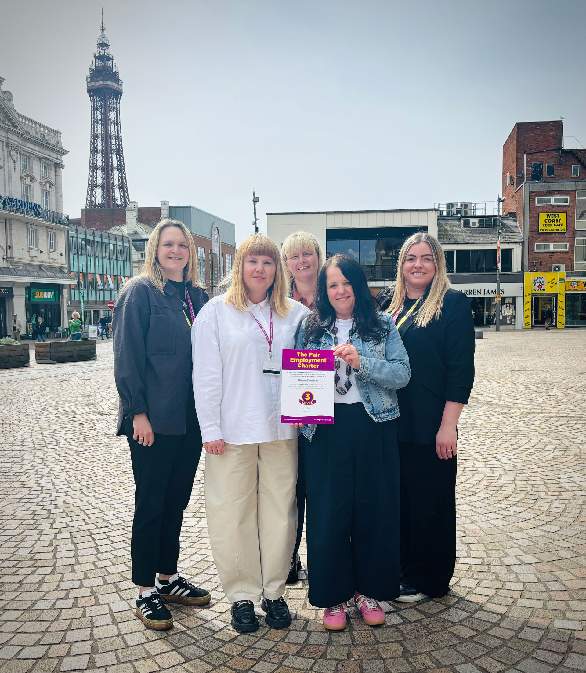 A group of people holding a certificate