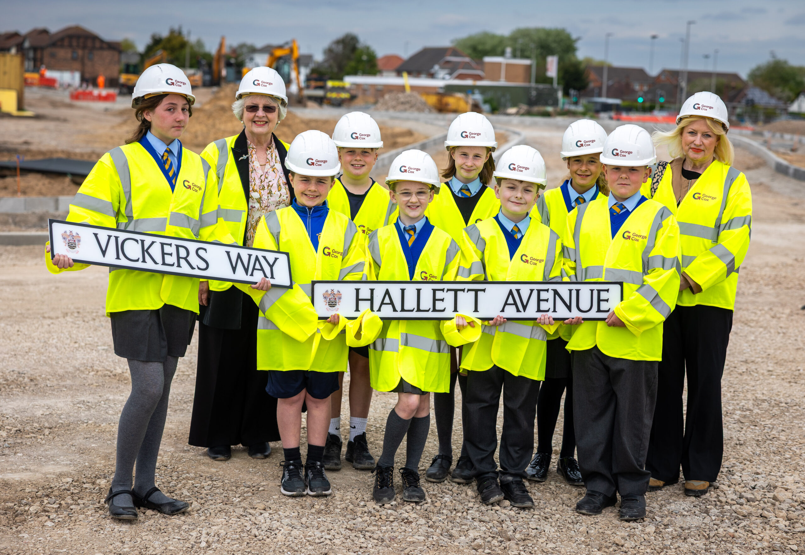 School children holding road signs