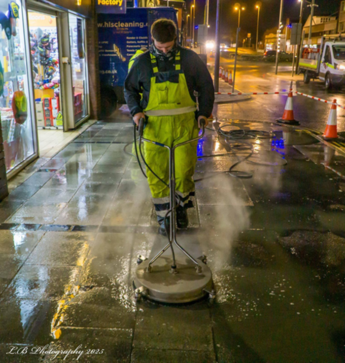 A man cleaning the street